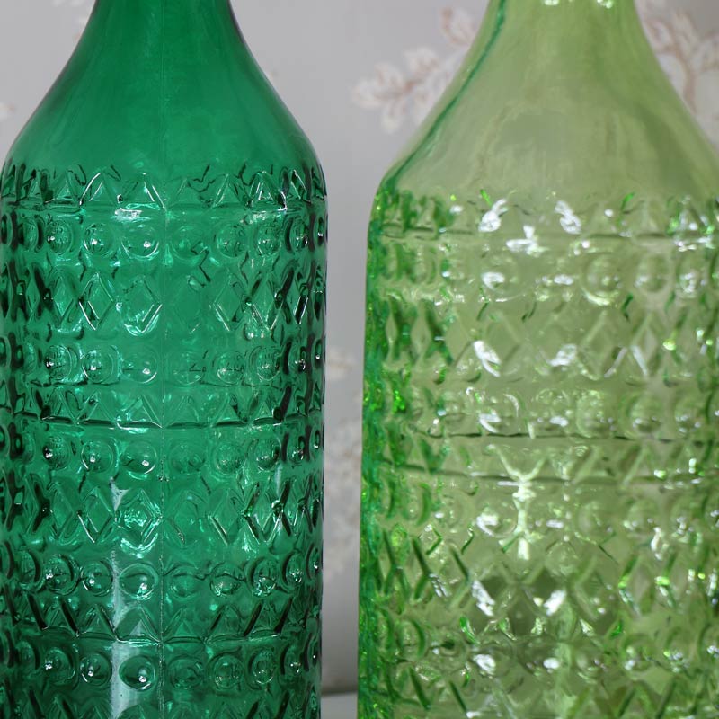 Pair of Green Glass Decorative Bottles