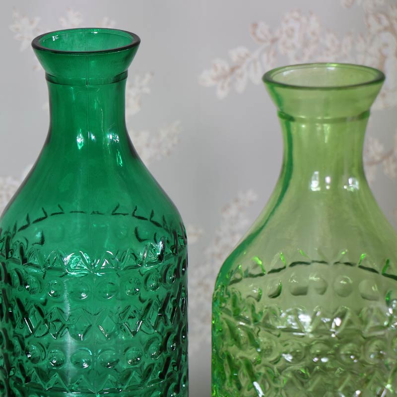Pair of Green Glass Decorative Bottles